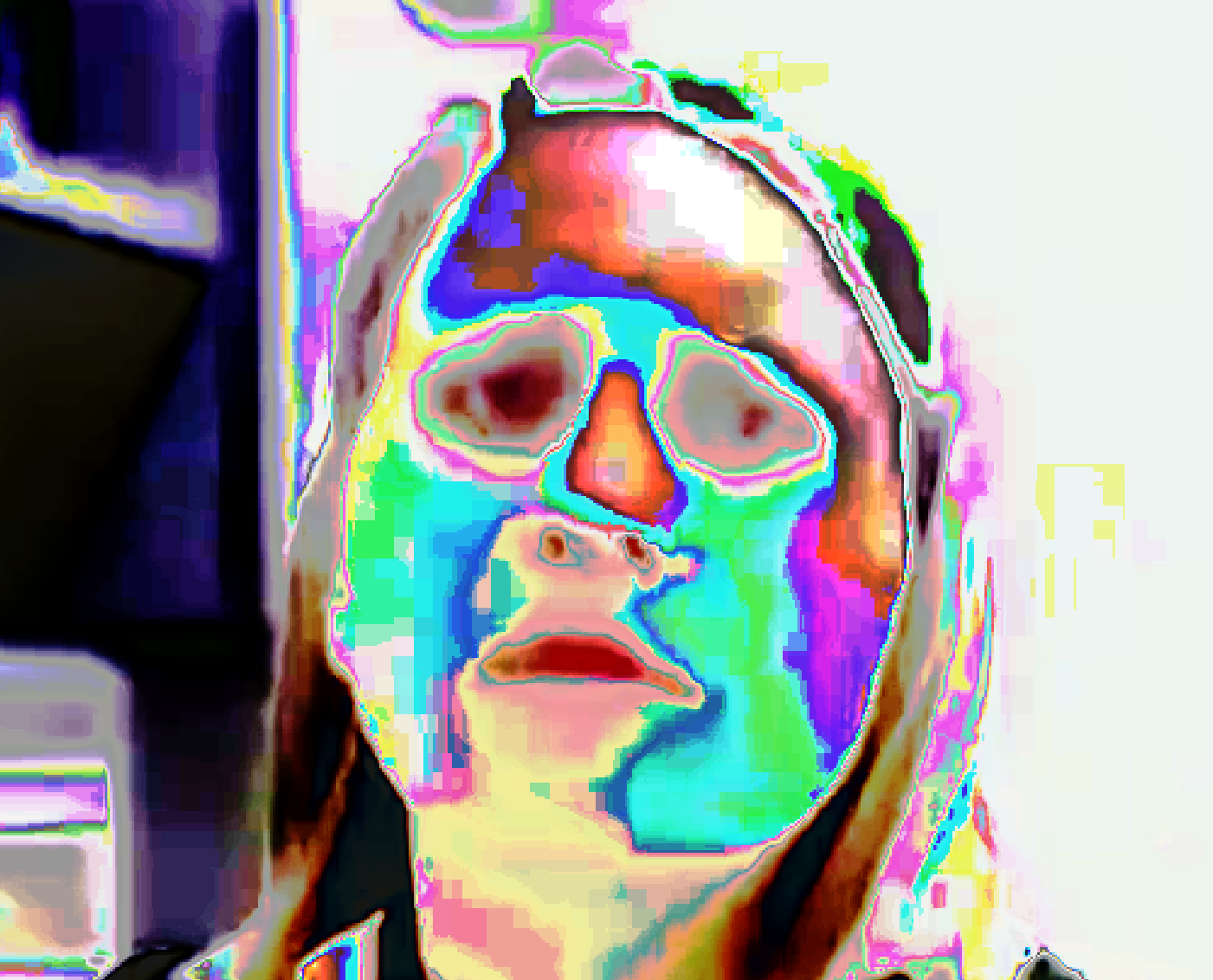Extreme color curves applied to frame 085 — face-swap blend boundary exposed