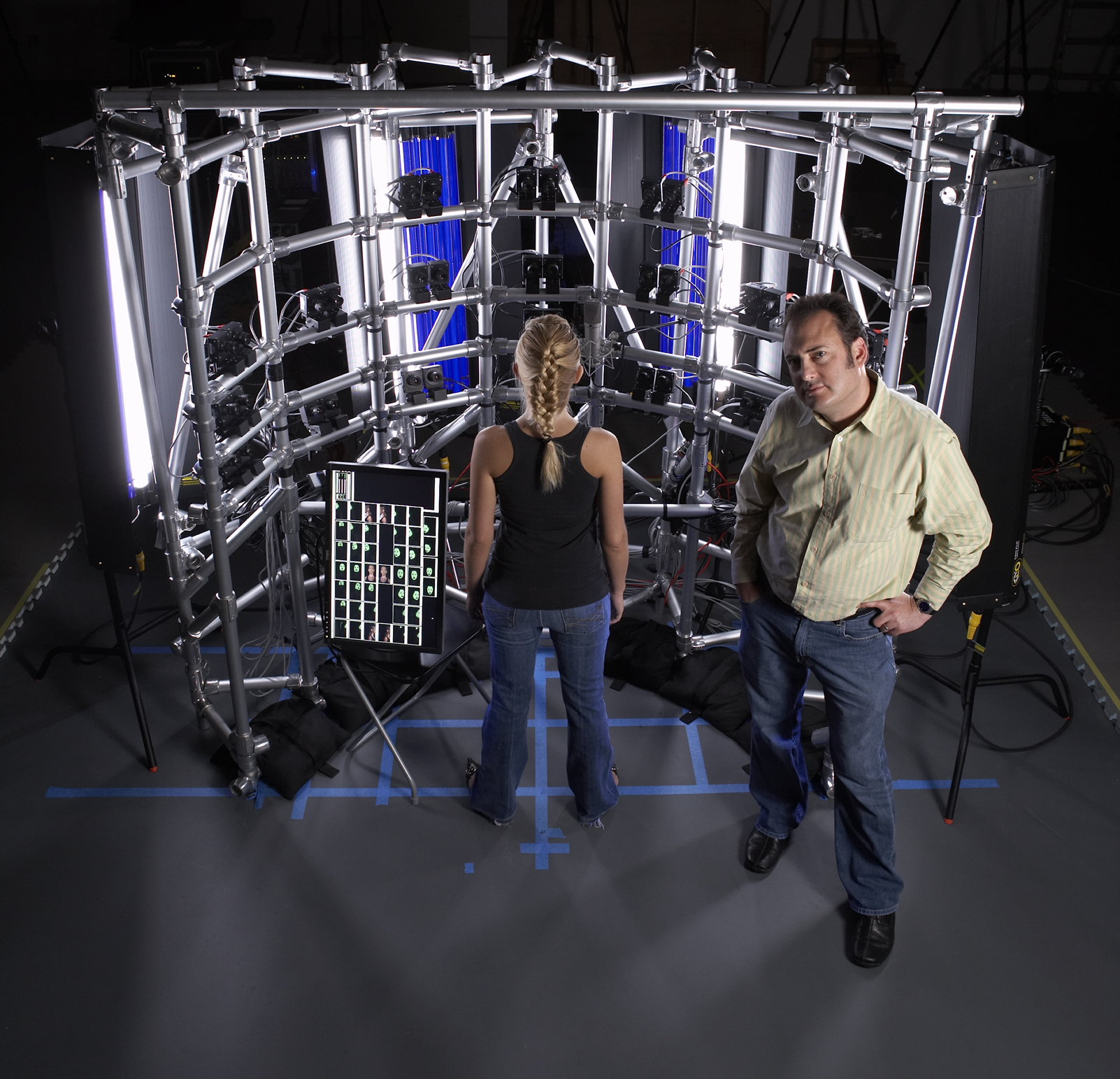 MOVA Contour Capture Volume — aluminum frame, blue LED lighting, actor in frame