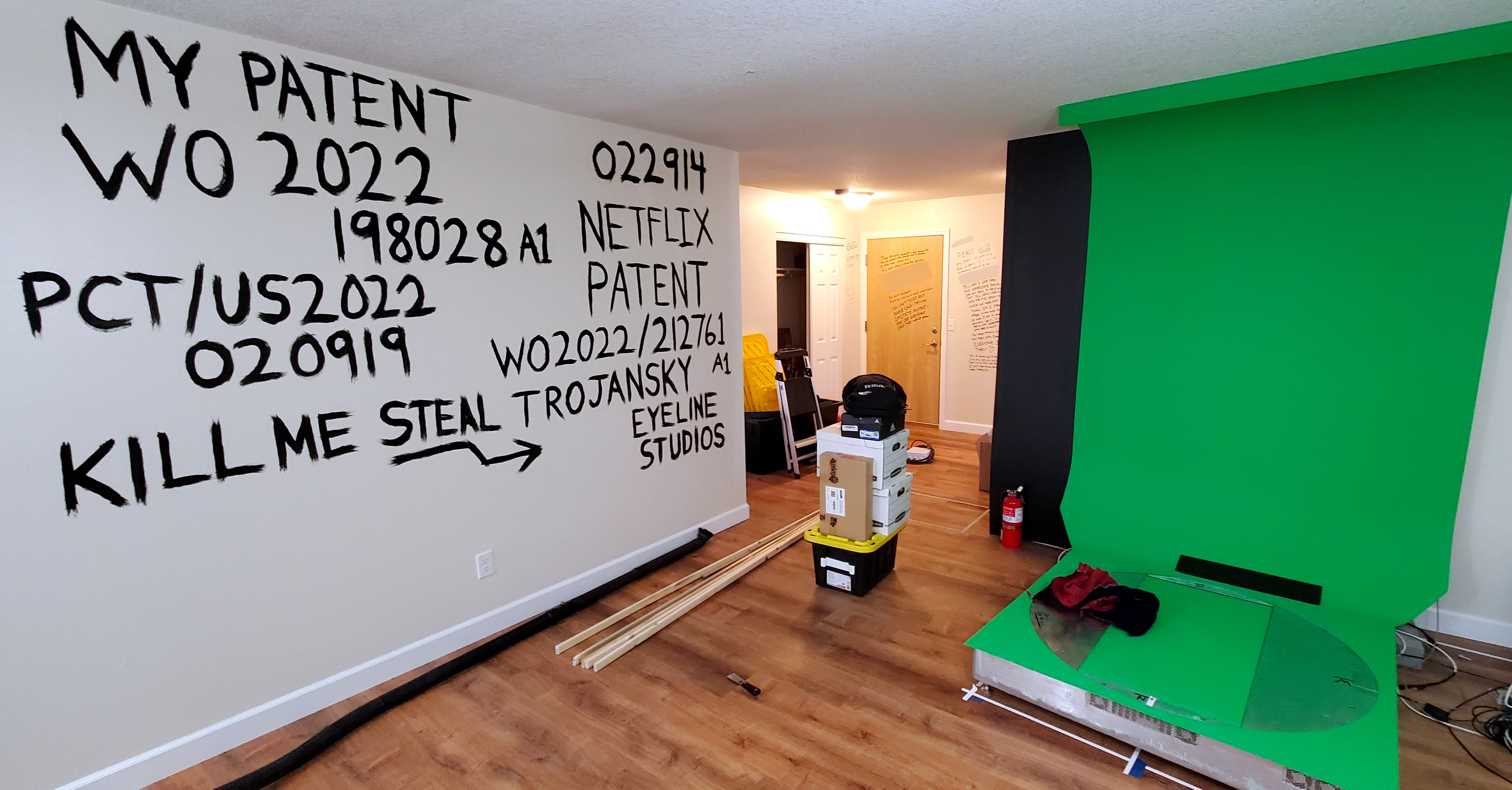 Guertin's apartment walls covered in patent numbers, Netflix references, and Minnetonka PD case number — written in permanent marker and black paint during the January 19-21 crisis